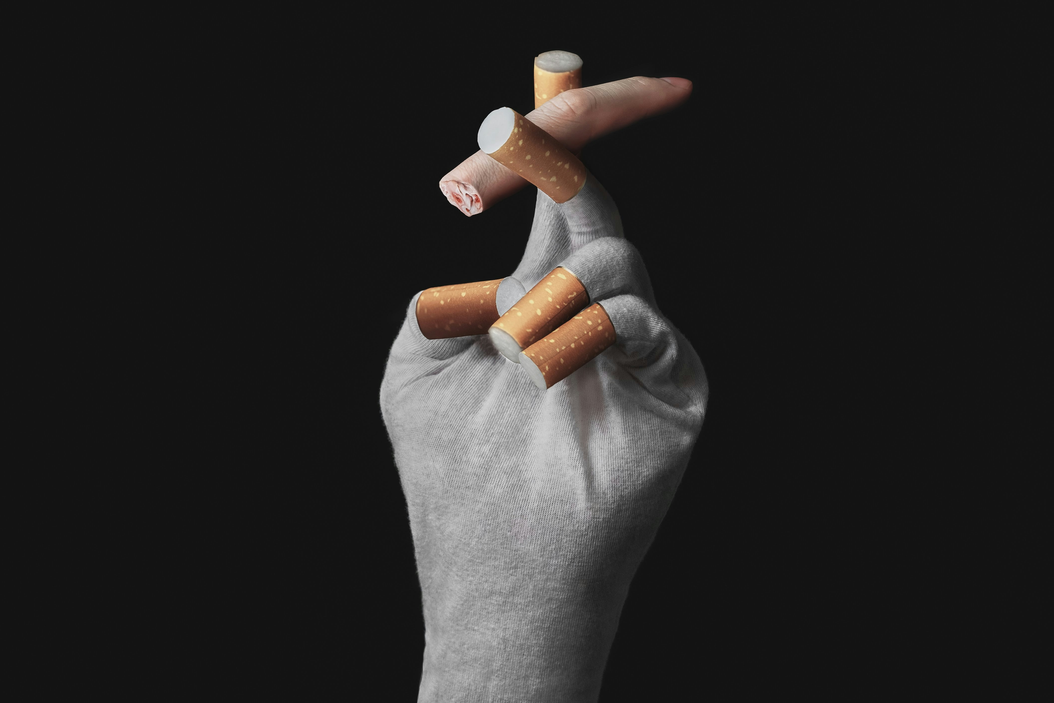 person holding orange medication pill